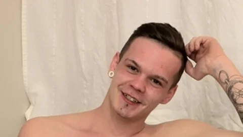 BlakeMason.com - Charley Cole jerking uncut dick on sofa